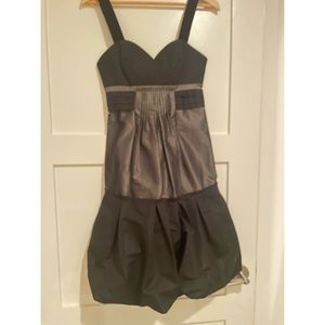 BCBG little black dress with gorgeous detailing on the chest and throughout.